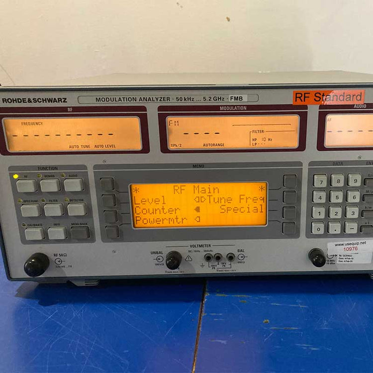 RF modulation analyzer with digital display on a blue surface