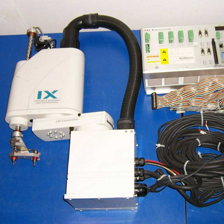 Technical equipment controller with robot with 'IX' branding on a blue surface