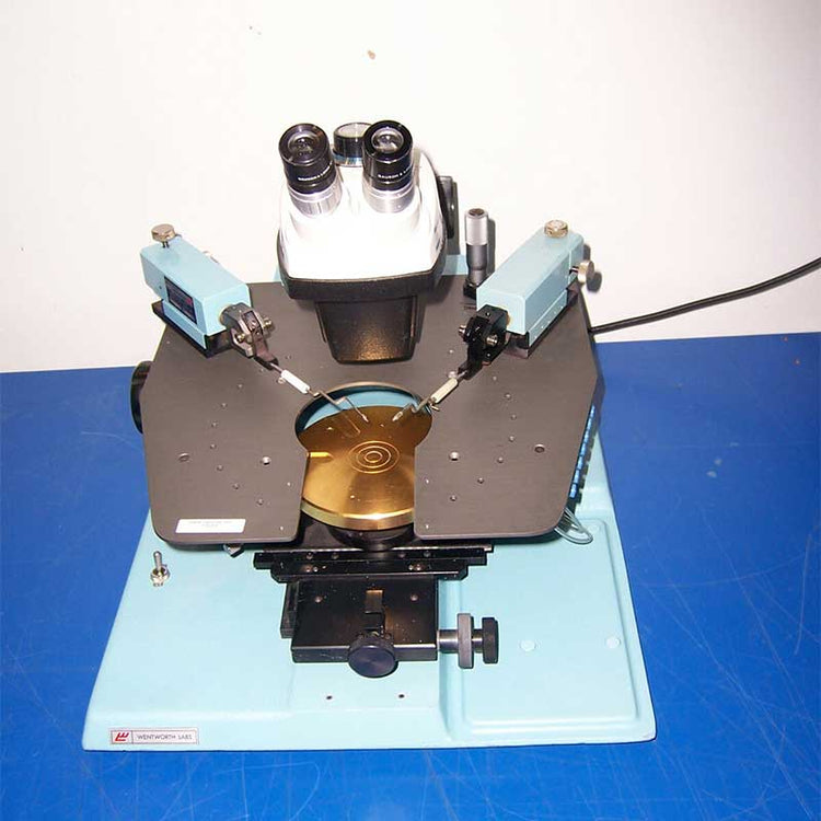 Microscope on a blue surface with a white background