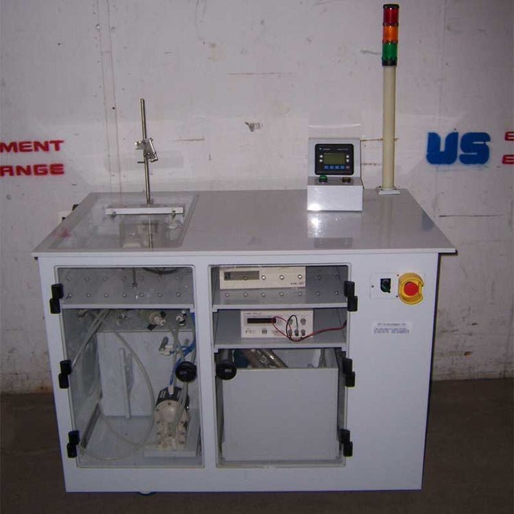 Acid etch station with white counter against a wall with 'US equipment exchange' branding