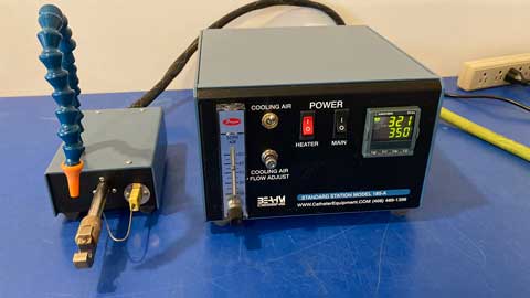 Beahm cooling air station control panel with digital display and various connectors on a blue surface