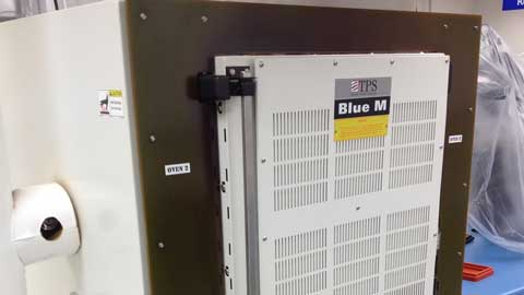 Blue M with 'Blue M' branding on a workshop background