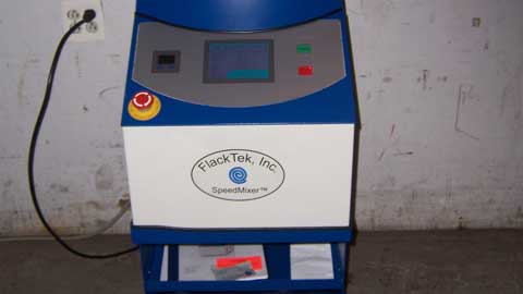 FlackTek, Inc. machine on a plain background