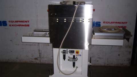 Stainless steel machine with a hose in a warehouse setting